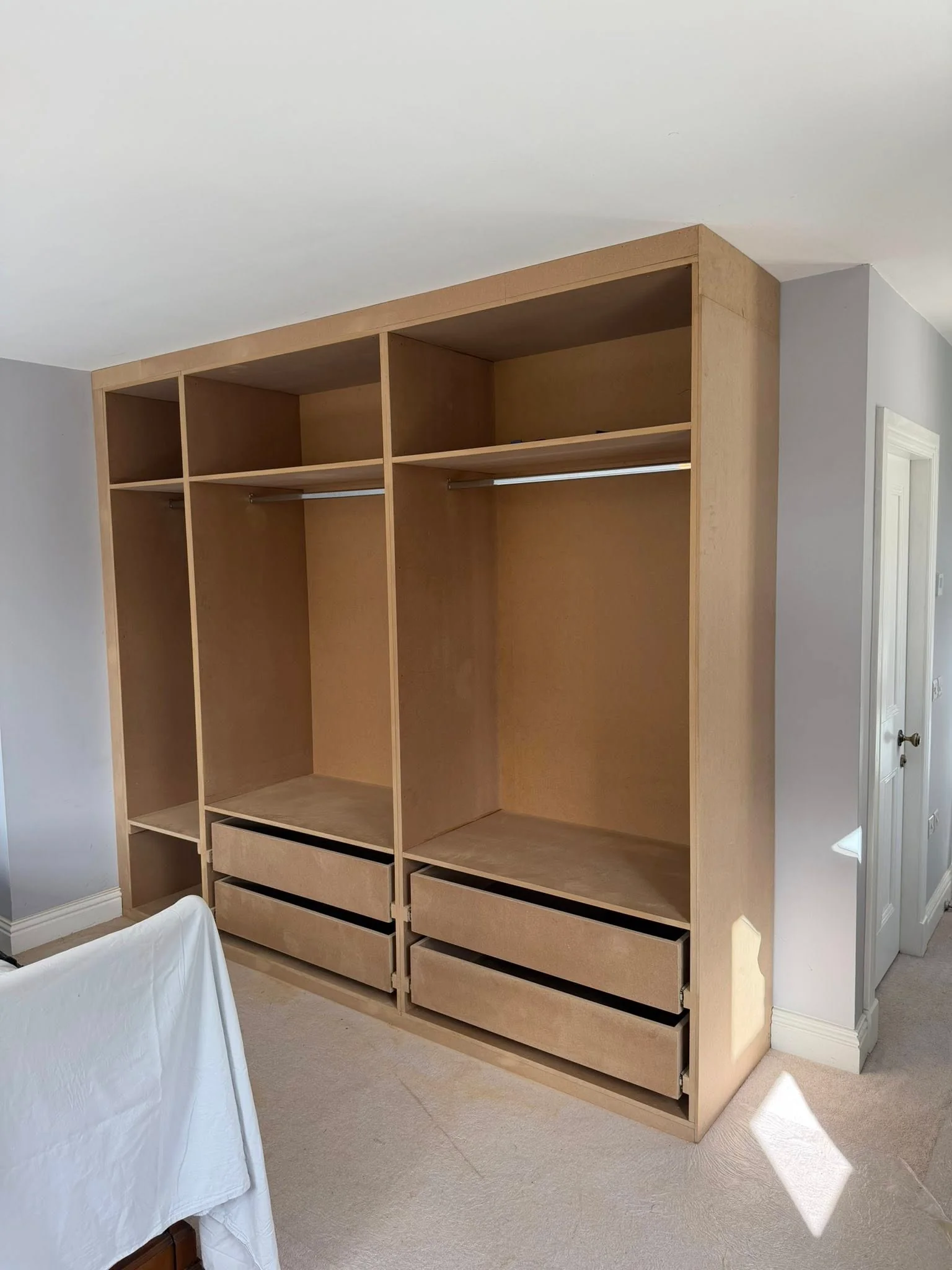 Custom fitted wardrobe by T M Joinery