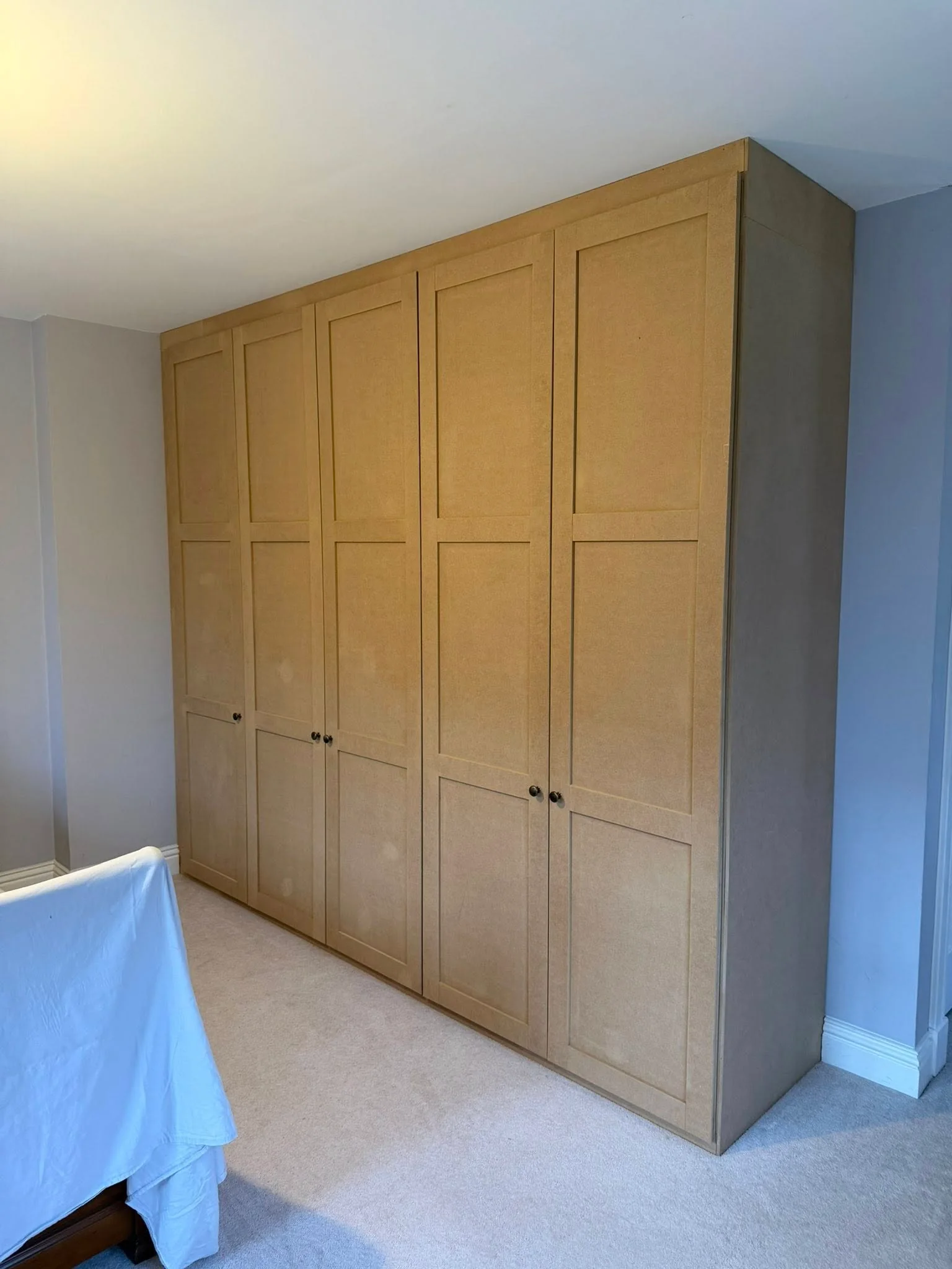 Bespoke wardrobe installation by T M Joinery